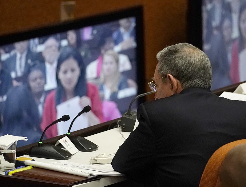 Cuba's President Raul Castro observes a monitor with he day's proceedings during the start of two-day session of the legislature, in Havana, Cuba, Wednesday, April 18, 2018. Cuba's legislature opened the two-day session that is to elect a successor to President Castro. (AP Photo/Ramon Espinosa)