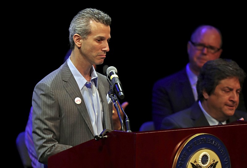In this Tuesday, April 3, 2018 photo, Max Schachter, whose son Alex was killed during the deadly shooting at Marjory Stoneman Douglas High School, speaks to the audience during a congressional town hall on gun violence in Coral Springs, Fla. Schachter has formed the Marjory Stoneman Douglas School Safety Commission to find ways to make schools safer. (John McCall/South Florida Sun-Sentinel via AP)