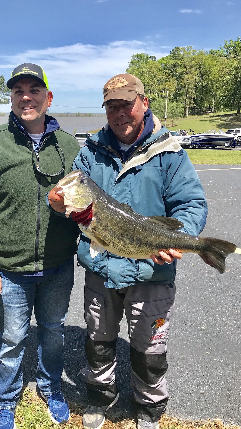 Doug Jordan, right, caught an incredible 11.1-pound large-mouth bass to win the fourth annual Cooper Tire Big Bass Tournament held Saturday, April 14, 2018, at Millwood Lake benefiting United Way of Greater Texarkana. This year's event brought 149 participants. The event is expected to raise more than $15,000 for the United Way this year. (Submitted photo)