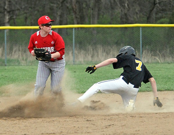 Calvary Lutheran second baseman Jared Braun (left) forces out St. Elizabeth's Kendal Bax at second during Tuesday's game at Calvary Lutheran. St. Elizabeth defeated Calvary Lutheran 21-2 in five innings.