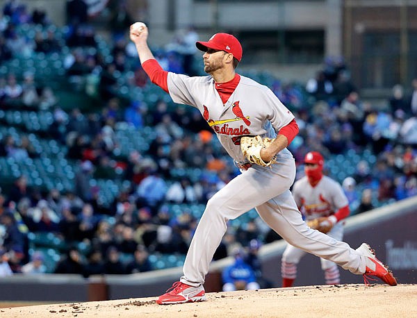 Cardinals starting pitcher Adam Wainwright delivers to the plate during the first inning of Tuesday's game against the Cubs in Chicago.