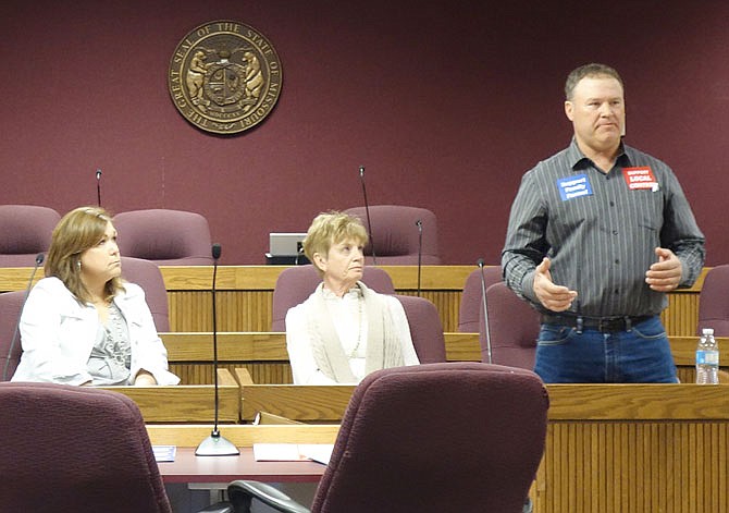 Tasha Stephens, left, of Jackson County, and Vickie Gassman, of Howard County, listen to Jeff Jones, of Callaway County, during a Family Farms, Not Factory Farms panel in April at the Capitol.