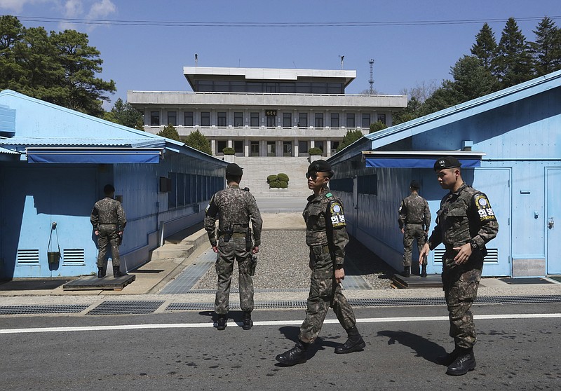 In this Wednesday, April 11, 2018, photo, South Korean army soldiers stand guard at the border villages of Panmunjom in Paju, South Korea. U.S. President Donald Trump on Tuesday, April 17, has given his "blessing" for North and South Korea to discuss the end of the Korean War at their summit next week amid a diplomatic push to end the North Korean nuclear standoff. (AP Photo/Ahn Young-joon)