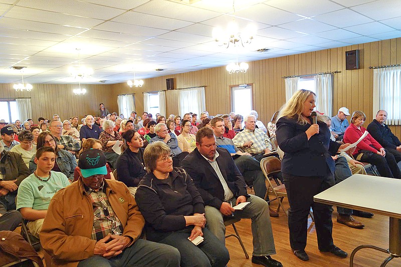 In this April 18, 2018 photo, Susan Hodges speaks against the proposed Tipton East CAFO for reasons such as potential water contamination and the potential to over-draw from the water table upon which area residents rely. She spoke during the public comment period of the Missouri Department of Natural Resources' meeting at Tipton Country Club.