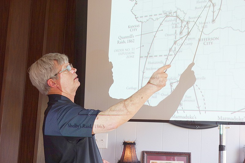 Joseph Whit McCroskie, co-author of a book about Missouri's role in the Civil War, walks Rotary Cub members through troop movements that affected Callaway County.