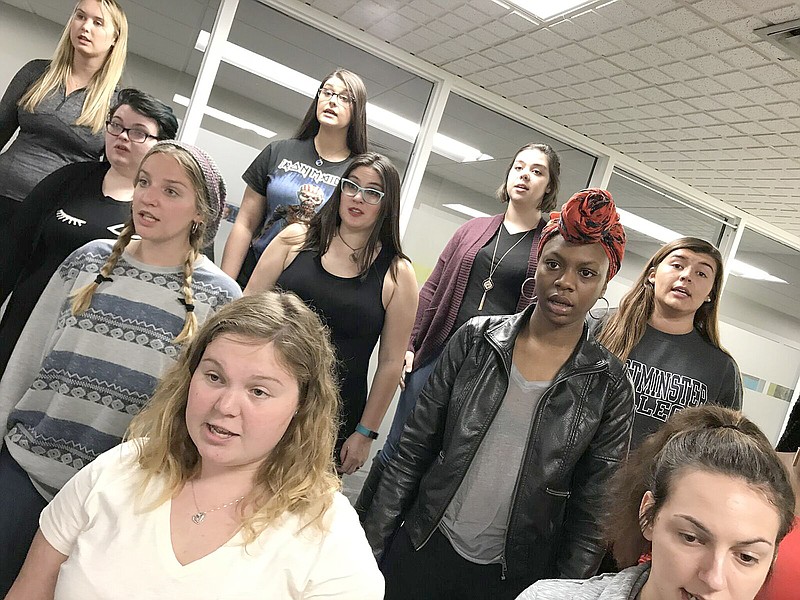 Members of the Churchill Singers at Westminster College practice for today's free concert. The concert's theme is charity and communion.