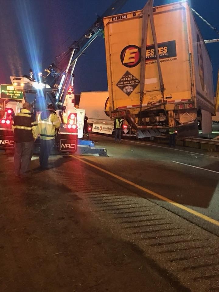 A tractor-trailer rolled over about 4:30 Thursday morning on Interstate 30 near the I-369 flyover. No injuries were reported.  (Photo courtesy of TTPD)
