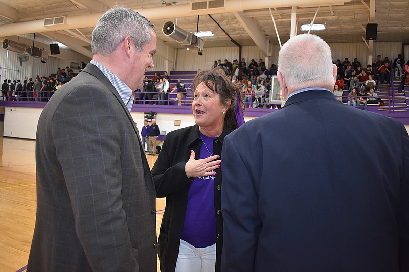 Principal Kay York, center, talks to members of the Arkansas Association of Secondary School Principals during an assembly in which she was given the Arkansas Principal of the Year award on Friday at Ashdown, Ark., High School. Dr. Richard Abernathy, the association's executive director, presented the award.