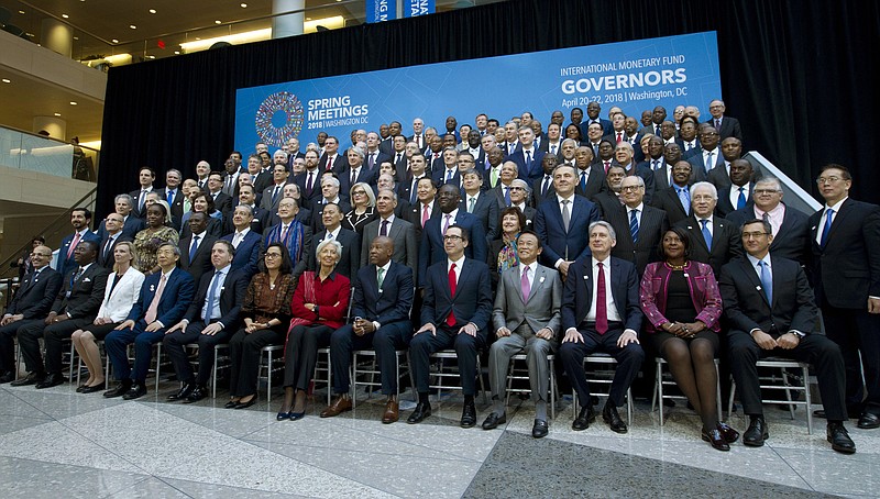 International Monetary Fund (IMF) Governors gather for a group photo during World Bank/IMF Spring Meetings in Washington, Saturday, April 21, 2018. ( AP Photo/Jose Luis Magana)