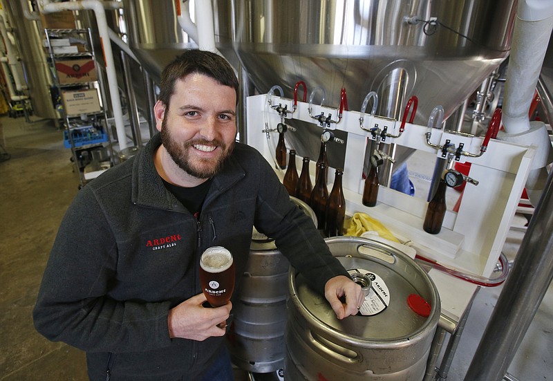Pulitzer Prize winning photojournalist, Ryan Kelly, poses in the brewery at his new job at Ardent Craft Ales in Richmond, Va., Tuesday, April 17, 2018. Kelly left journalism shortly after shooting his prize winning photo to work in the social medial division of the brewery. (AP Photo/Steve Helber)