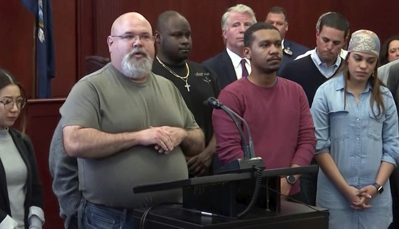 In this image taken from video on Wednesday, April 18, 2018, jurors in the murder trail of Yoselyn Oretga, the nanny who stabbed two small children to death in the bathtub of their Manhattan apartment, hold a news conference in New York.  The Jurors say the nearly two-month-long experience took an emotional toll they fear will linger long after their guilty verdict.  Oretga was convicted of murder in the deaths of 6-year-old Lucia Krim and 2-year-old Leo Krim after the jury rejected her mental illness defense.  (AP Photo/APTN)