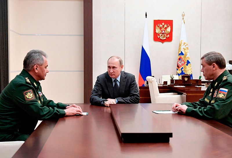 Russian President Vladimir Putin, center, Russian Defense Minister Sergey Shoigu, left, and Chief of the General Staff of the Russian Armed Forces Valery Gerasimov during a meeting Friday in Moscow. A new poll from The Associated Press-NORC Center for Public Affairs Research shows that most Americans fear the United States' relationships with Russia and China will get worse in the coming year.