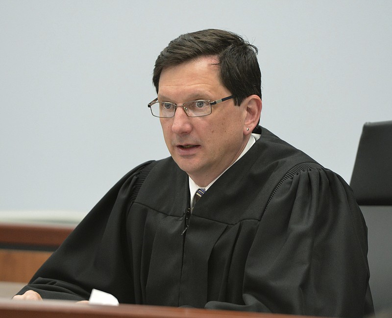 FILE - In this March 21, 2016, file photo, Judge Thomas Estes presides in Eastern Hampshire District Court in Belchertown, Mass. The Commission on Judicial Conduct is asking for Judge Estes to be suspended indefinitely without pay to give lawmakers time to decide whether to remove him from the bench for his relationship with Tammy Cagle, who worked in the special drug court where Estes sat. (Don Treeger/The Republican via AP, File)