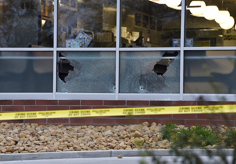 Bullet holes are seen at a Waffle House after a fatal shooting in the Antioch neighborhood of Nashville, Sunday, April 22, 2018. (George Walker IV/The Tennessean via AP)