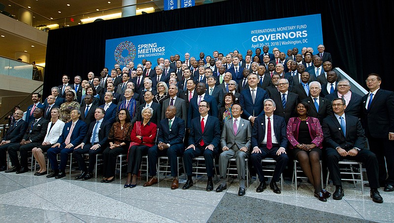 International Monetary Fund (IMF) Governors gather for a group photo during World Bank/IMF Spring Meetings in Washington, Saturday, April 21, 2018. ( AP Photo/Jose Luis Magana)