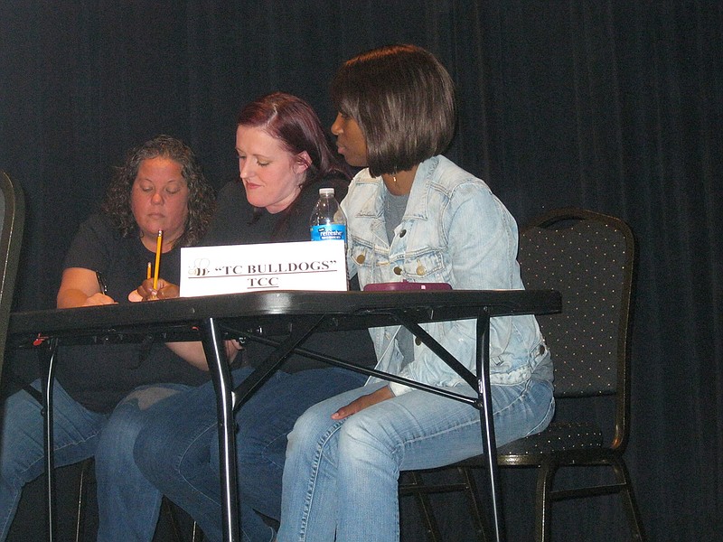 Texarkana College spelling bee team members, from left, Patti Meyer, Kelli Reed and LaMoya Burks nearly won the 24th annual Corporate Spelling Bee Saturday. After a long battle with the Texarkana Gazette team, TC lost by one letter in spelling the word ichthyophagy, which means "liking to eat fish." The other two teams were from Commercial National Bank, which won the Costume Award, and Texarkana Retired Teachers, which got the Spirit Award. Proceeds from the event benefit the Literacy Council of Bowie and Miller Counties.