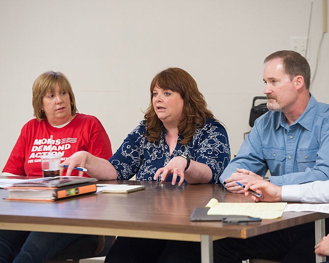 Susan Cook-Williams of Sandy Hook Promise, center, replies to an audience question Saturday during the Preventing Gun Violence Forum, as Susan Randolph of MOMS Demand Action, left, and 60th Missouri House District candidate, Kevin Nelson, right, listen.