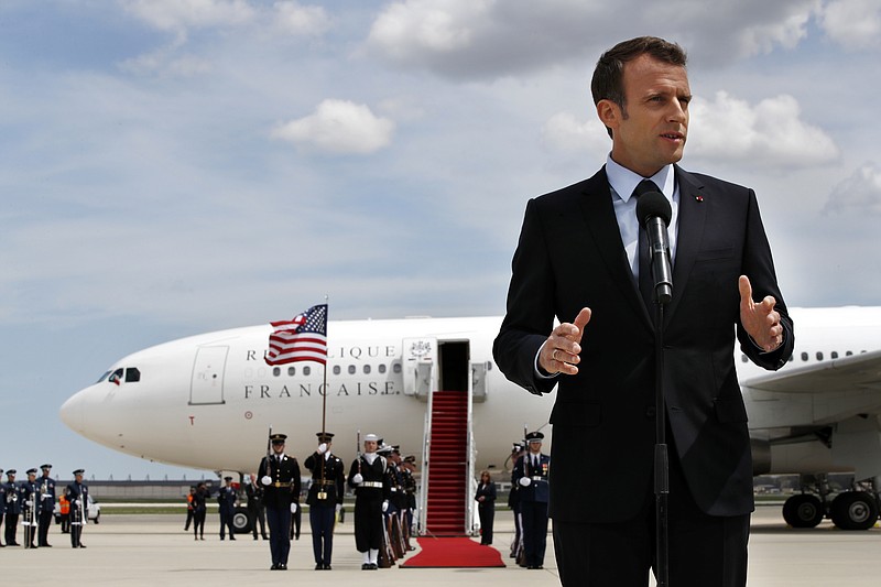 French President Emmanuel Macron speaksa on arrival at Andrews Air Force Base, Md., Monday April 23, 2018, outside of Washington. President Trump, celebrating nearly 250 years of U.S.-French relations, will be hosting Macron at a glitzy White House state visit. (AP Photo/Jacquelyn Martin)