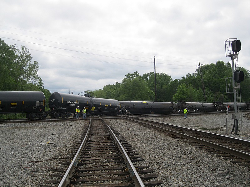 Union Pacific Railroad work crews survey the scene of a 12 tank car derailment that occurred about 11:30 a.m. Sunday near the Texarkana, Texas-side viaduct. All 12 tank cars carried crude oil but none of them ruptured during the derailment and no oil apparently spilled.