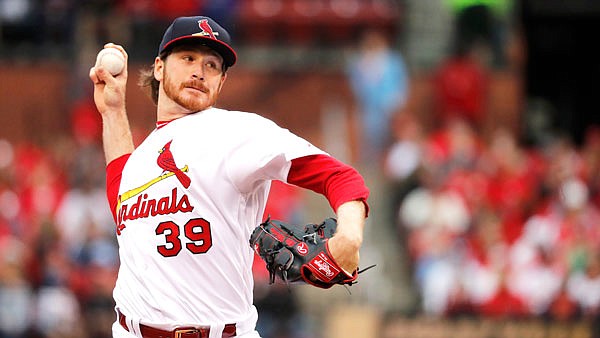 Cardinals starting pitcher Miles Mikolas throws during the first inning of Sunday afternoon's game against the Reds in St. Louis.