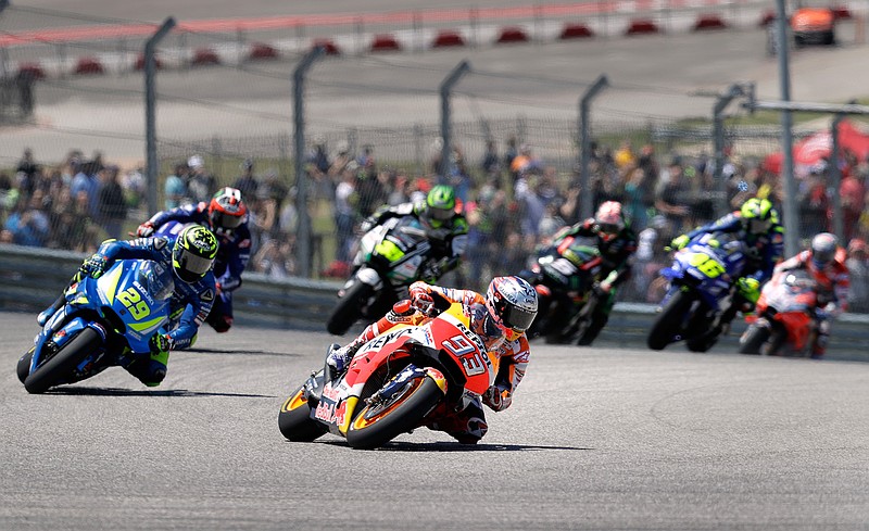 Marc Marquez (93) leads Andrea Iannone (29) through Turn 1 during the Grand Prix of the Americas motorcycle race Sunday at the Circuit of the Americas in Austin.