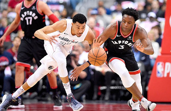 Wizards forward Otto Porter Jr. battles for the ball against Raptors forward OG Anunoby during the first half Sunday in Game 4 of a first-round playoff series in Washington.