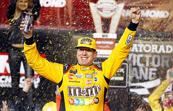 Kyle Busch celebrates Saturday night after winning the NASCAR Cup Series race at Richmond Raceway in Richmond, Va.