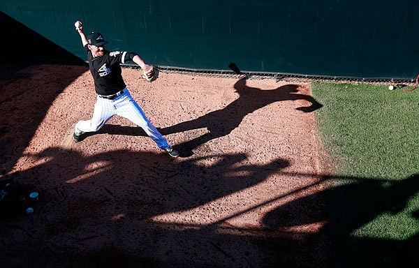 White Sox relief pitcher Danny Farquhar warms up in the bullpen during a spring training game against the Dodgers last month in Glendale, Ariz.