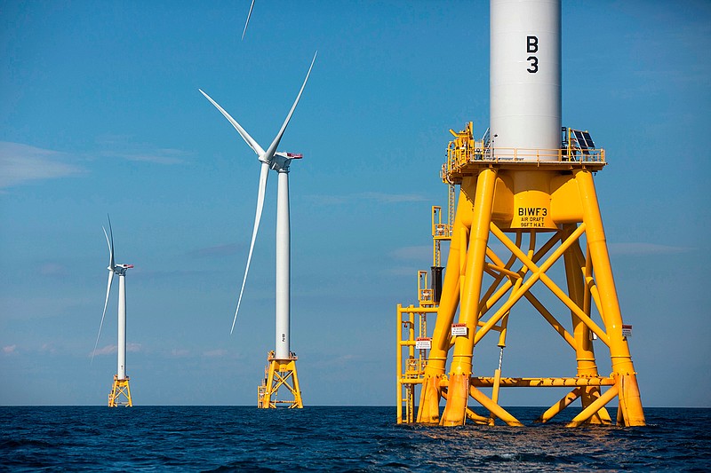 This Aug. 15, 2016, file photo shows three of Deepwater Wind's turbines standing in the water off Block Island, R.I. Using federal offshore leases, wind power projects along the East Coast are pressing ahead in 2018, with the goal of transforming the electric grid and providing energy to power millions of homes. 