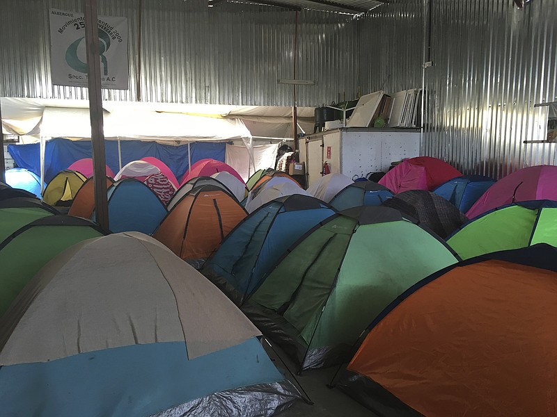 Temporary tents for about 130 Central Americans, mostly women and children, who arrived at the U.S. border with Mexico in a "caravan" of asylum-seeking immigrants that has drawn the fury of President Donald Trump, are seen in a shelter in Tijuana, Mexico, on Tuesday, April 24, 2018. Two busloads arrived late Tuesday, in the Mexican border city of Tijuana, and another 200 were expected to come. Legal workshops are planned later this week and the first large group is expected to try to enter the United States on Sunday at a border crossing in San Diego. in San Diego, Calif. (AP Photo/Elliot Spagat)