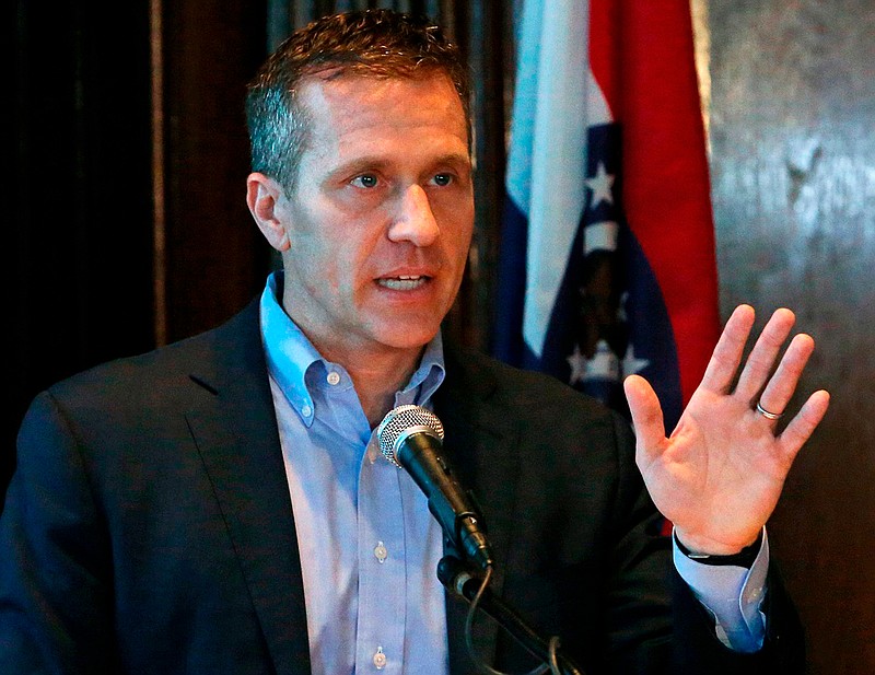 FILE - In this April 11, 2018 file photo, Missouri Gov. Eric Greitens speaks at a news conference in Jefferson City, Mo. A judge is expected to consider a request to disqualify St. Louis prosecutors from one of the two felony cases against Gov. Greitens. A hearing is scheduled for Tuesday, April 24, 2018 in the computer data tampering case against Greitens. Defense lawyers asked Judge Rex Burlison to require a special prosecutor in the computer tampering case, citing the use of a private investigator in the other felony case against Greitens. (J.B. Forbes/St. Louis Post-Dispatch via AP, File)