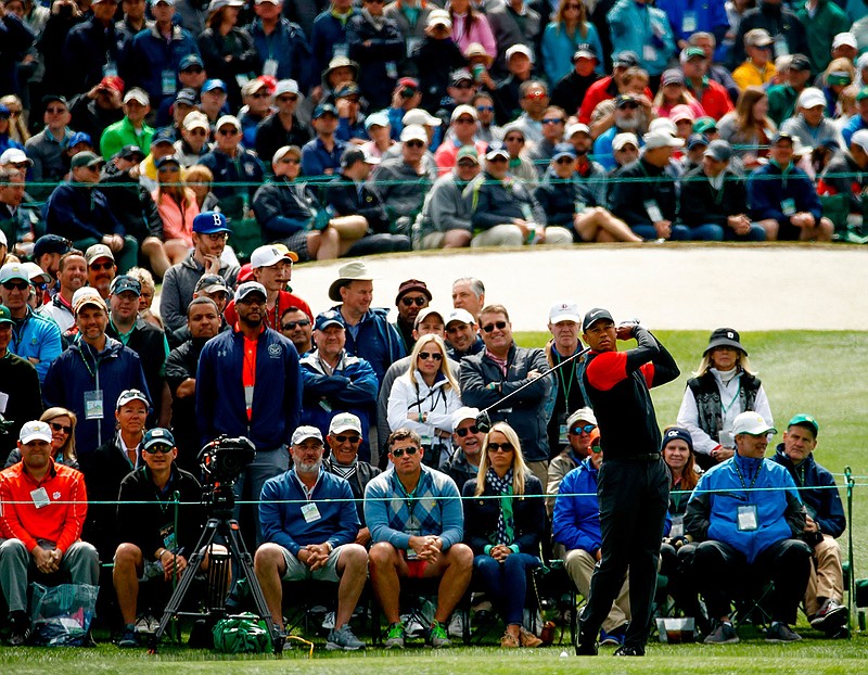 In this April 8, 2018, file photo, Tiger Woods hits a drive on the third hole during the fourth round at the Masters golf tournament in Augusta, Ga. Woods brought back the largest crowds to golf with his return from back surgery. (AP Photo/Charlie Riedel, File)