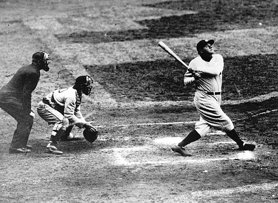 In this undated file photo,Babe Ruth hits a home run during a game for the New York Yankees.