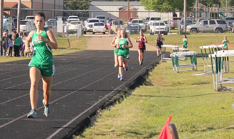 Genoa Central's Carlie Teague leads the pack as she finishes her third leg during the girls 1,600 meters at the 7-3A conference track and field championships Tuesday at Byron Bryant Field on the campus of Genoa Central High School. Teague won the race.