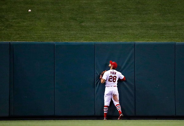 Cardinals center fielder Tommy Pham watches a solo home run by the Mets' Jay Bruce during the 10th inning of Tuesday's game in St. Louis.