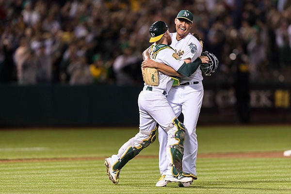 Athletics starting pitcher Sean Manaea (right) celebrates with catcher Jonathan Lucroy after pitching a no-hitter Saturday against the Red Sox in Oakland.