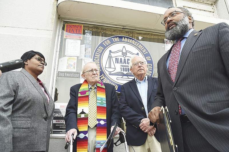 Standing with Kim Woodruff of A.M.E. Quinn Chapel, left, are Jon Bennett, retired pastor and Faith Voices member, and Empower Missouri's Don Love, along with state NAACP President Rod Chapel Jr., right, who issued a statement regarding possible legislative proposals aimed at restricting protestors' access to highways and limited access to roadways.