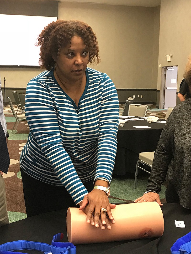 Felecia M. Thomas, a nurse at Ashdown High School, stuffs a wound with gauze during Stop the Bleed training Wed-nesday at the Texarkana, Ark., Convention Center.
Staff photo by Ashley Gardner