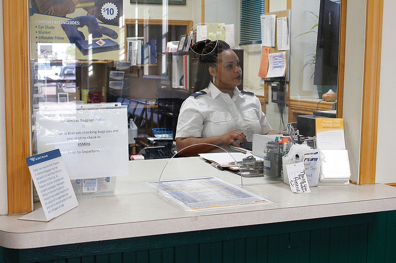 Shanaye Watkins works in the Amtrak ticket office on Friday at Union Station in downtown Texarkana. As more passengers choose to purchase tickets online, Amtrak announced they will close the Texarkana ticket office. Watkins has been with Amtrak for 11 months and hopes to find new opportunties within the company.