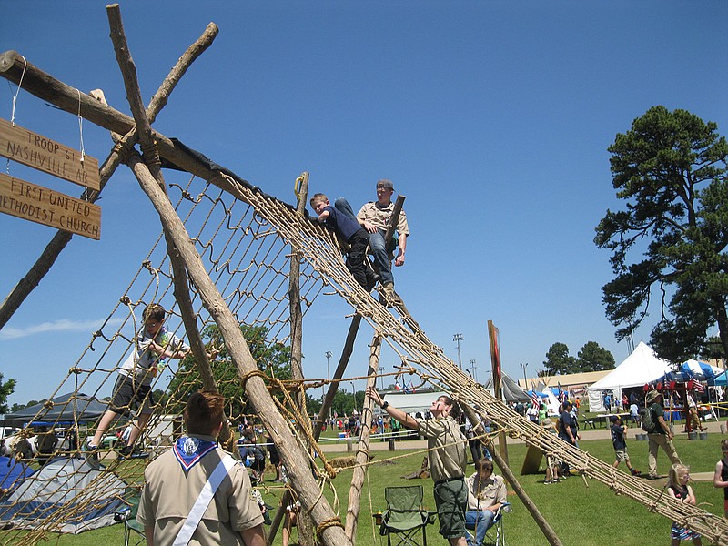 Scouts serve as safety spotters as they help children learn the art of rope climbing Saturday during the annual Scout-O-Rama at Spring Lake Park.