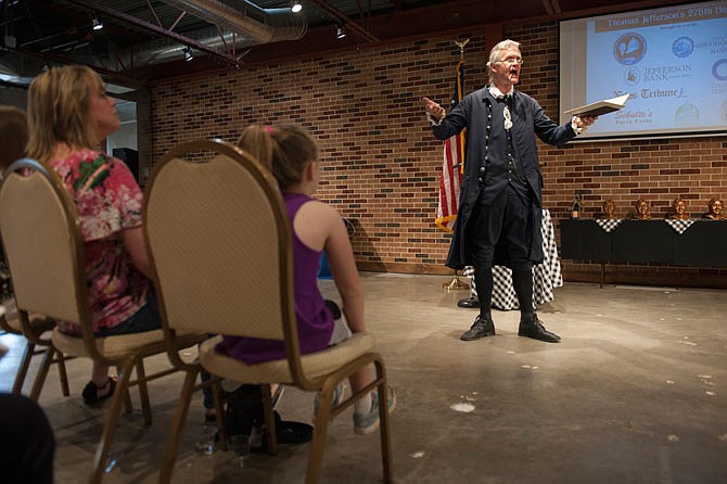 Thomas Jefferson, played by Patrick Lee, reads his "10 Rules of Life" on Monday during a celebration for Thomas Jefferson's 275th birthday at Avenue HQ.