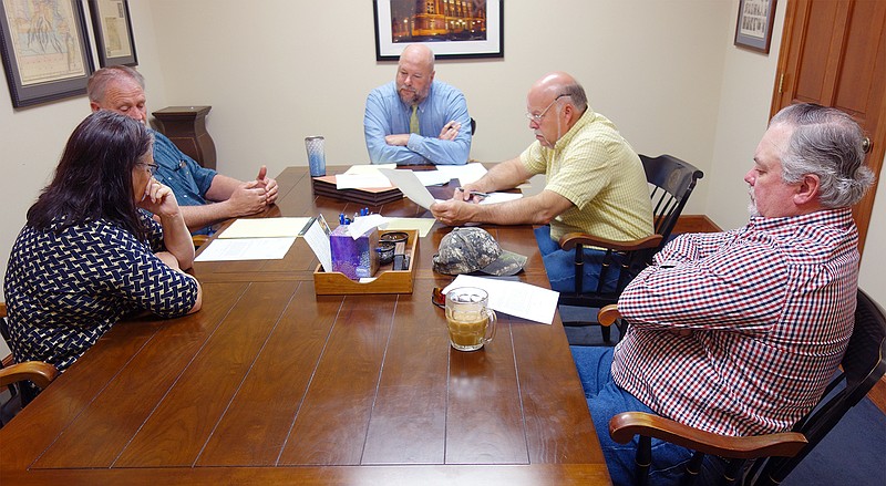FILE —Callaway County health department members Mylene Dunn, left, and Kent Wood; lawyer Tom Riley; and county commissioners Gary Jungermann and Randy Kleindienst gathered to discuss ballot language for a county sewer district. Voters on Tuesday approved the sewer district by a narrow margin.