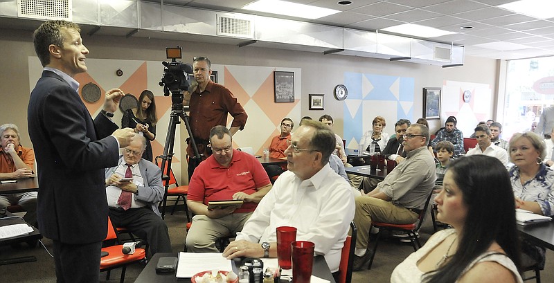 FILE PHOTO: Eric Greitens talks to a group of supporters at Downtown Diner Thursday, July 16, 2015. At the time, Greitens was considering a run for Missouri governor and conducting a series of small meetings with people to hear their ideas and to share his.