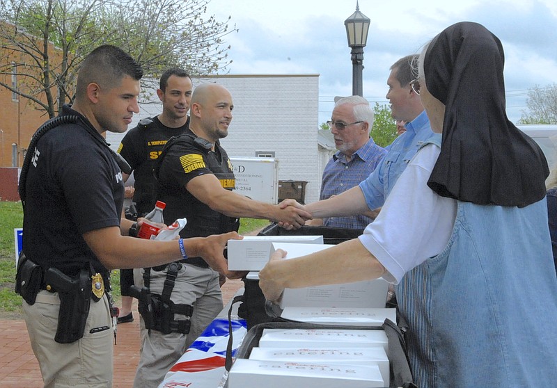 The California Ministerial Alliance provided a meal for emergency responders and county workers, following the National Day of Prayer observance at noon May 3, 2018 on the Moniteau County Courthouse front lawn.