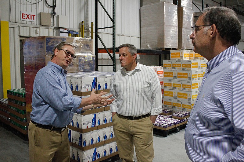 Arkansas Sen. John Boozman, R.-Ark., right, and Rep. Bruce Westerman, R.-Ark., center, tour the warehouse of Eagle Distributing of Texarkana, the local Anheuser-Busch distributor. The local tour was led by Tim O'Neal, president. It was part of a multi-day, multi-city tour to touch base with Arkansas small-business operators and get first-hand feedback about their concerns and needs.