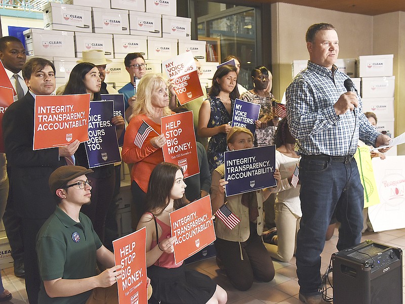 Fourth-generation Callaway County farmer Jeff Jones addresses the media Thursday in the Missouri State Archives Building. He and other representatives of the Clean Missouri initiative presented the Secretary of State's office with over 344,000 signatures on petitions to increase integrity, transparency and accountability in state government. They hope to get the legislative reform amendment on the November ballot.