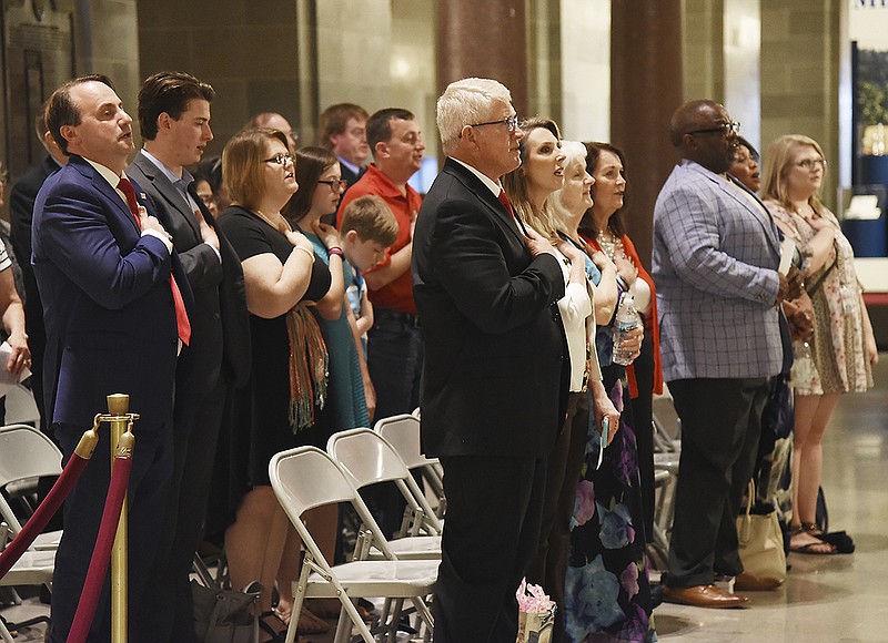 The crowd gathered for the National Day of Prayer event Thursday, May 3, 2018, in the Missouri State Capitol stand with hand over heart for the national anthem. 