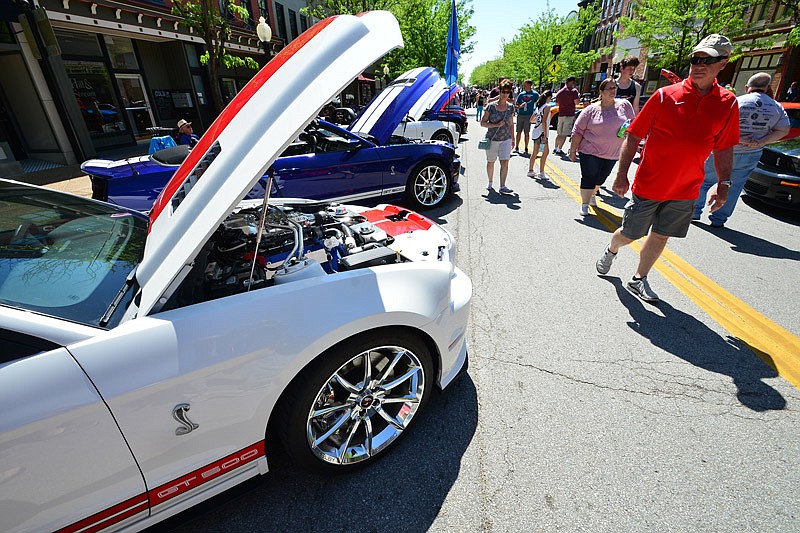 Auto lovers admire the wide variety of choice vehicles on display May 5, 2018, during the 12th annual Shelbyfest All Mustang Rally held in downtown Jefferson City. 