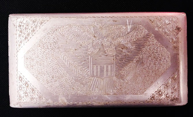 Former Jefferson City resident Lyman Lester McDowell was given this cigarette case by his brother-in-law, Dwight Taylor, during World War II. The case was crafted by an Italian prisoner of war held at Camp Weingarten south of St. Louis. 