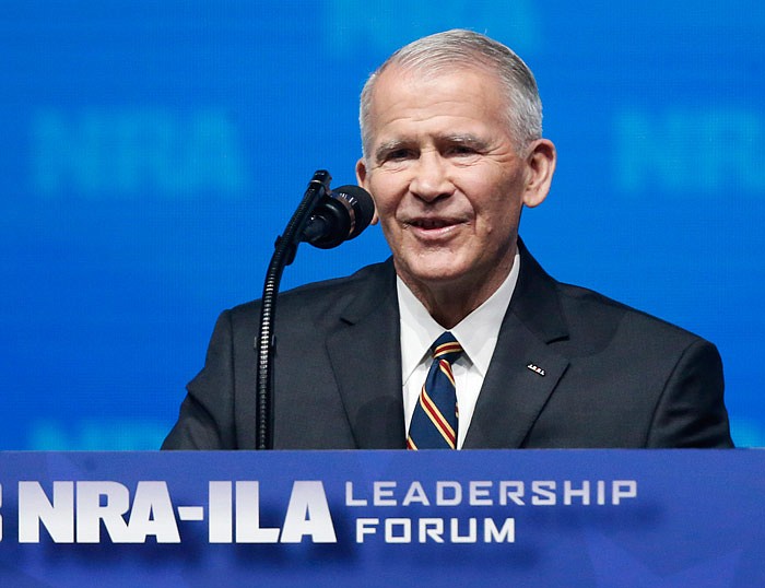 In this May 4, 2018 photo, former U.S. Marine Lt. Col. Oliver North speaks before giving the Invocation at the National Rifle Association-Institute for Legislative Action Leadership Forum in Dallas. The NRA announced today that North will become President of the National Rifle Association of America within a few weeks, a process the NRA Board of Directors initiated this morning. (AP Photo/Sue Ogrocki)